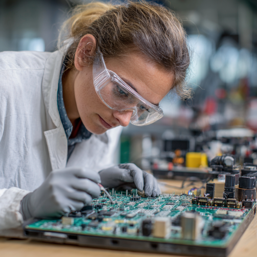Woman inspecting PCB board